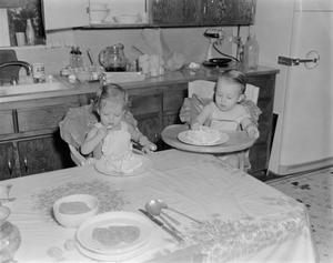 [Photograph of Byrd IV and Pam as toddlers eating cakes]