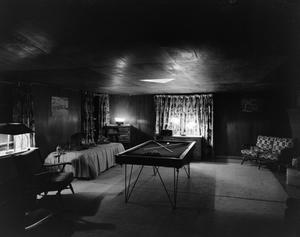 [Photograph of the interior of a room with a billiard table]