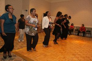 [Women lined up to dance at 2012 TABPHE conference 2]
