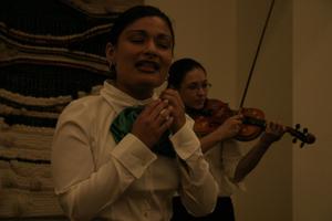 [Mariachi singer and violinist at 2004 La Raza graduation]