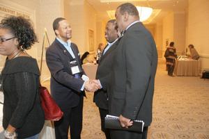 [Handshake at 2012 TABPHE conference event]