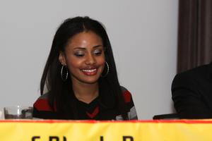 [Young woman at panelist table during 2012 TABPHE conference]