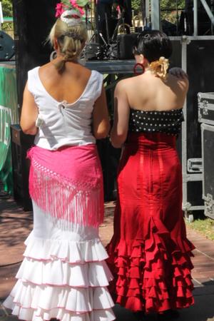 [Two women in dresses at carnaval]