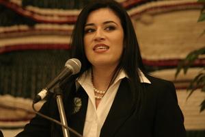 [Young woman speaking at 2004 La Raza event 5]