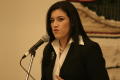 Photograph: [Young woman speaking at 2004 La Raza event 3]