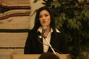 [Young woman speaking at 2004 La Raza event 1]