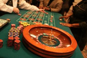 [People around roulette table at 2012 TABPHE conference 2]
