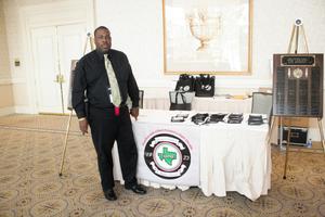 [Man at check-in table at 2012 TABPHE conference]