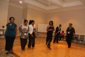 [Women lined up to dance at 2012 TABPHE conference 1]