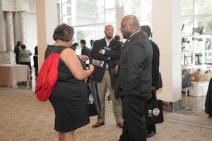 [People mingling in hallway at 2012 TABPHE conference 2]