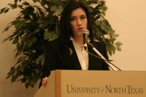 [Young woman speaking at 2004 La Raza event 8]