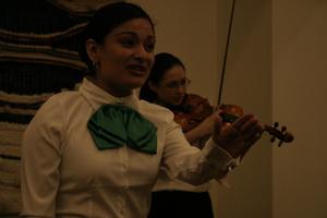 [Mariachi singer and violinist at 2004 La Raza ceremony]