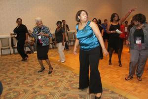 [Women learning dance at 2012 TABPHE conference 2]
