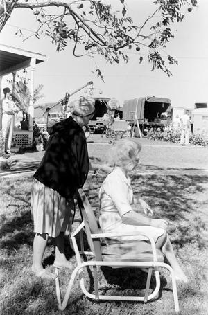 [Alice Faye and an assistant preparing for filming]