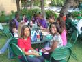 Primary view of [Students sitting at tables for 2005 Koinonia]