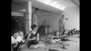 [News Clip: Women learning to shoot rifles]