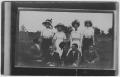 Photograph: [Four women and four men posing together]