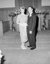 Photograph: [Photograph of a man and a woman in formal attire]