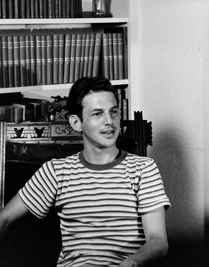 [Photograph of Charles Williams in a striped shirt]