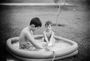 [Tim and Byrd in a kiddie pool]