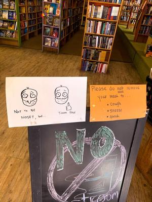 [Face mask signage in Recycled Books]