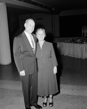 [Man and woman in formal attire, posing together, 2]