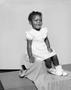 Photograph: [Little girl in a dress, sitting, 2]