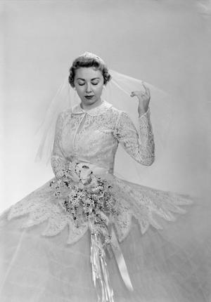 [Photograph of Joan Powell in her wedding dress]