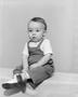 Photograph: [Toddler boy in overalls, boots and a short-sleeve shirt, 2]