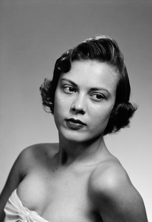 [Woman posing in a strapless top, 3]