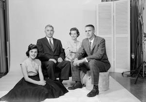 [Four person family posing in a studio, 1]