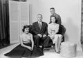 Photograph: [Four person family posing in a studio, 2]