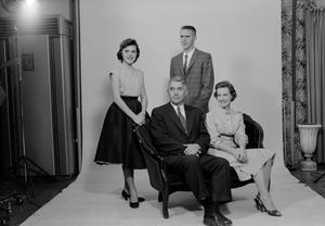 [Four person family posing in a studio, 3]