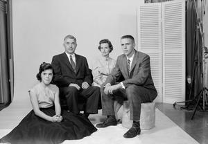 [Four person family posing in a studio, 4]