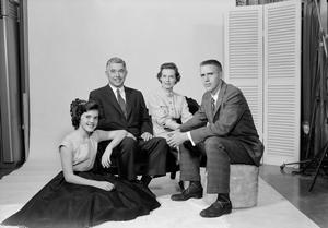 [Four person family posing in a studio, 5]