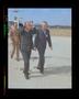 Photograph: [Iranian officials walking on the Bell helipad]