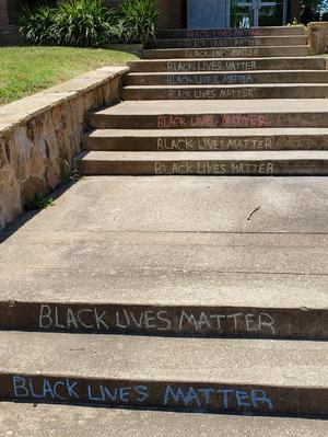 [Black Lives Matter chalk writing at Denton Wesley Foundation]