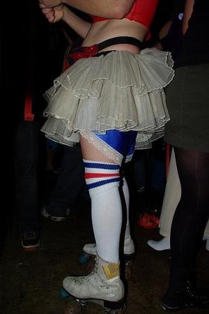 [Person in skirt from the waist down]