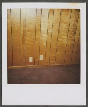[Wooden wall with two outlets]