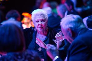 [A woman conversing with others at the UNT College of Music Gala]