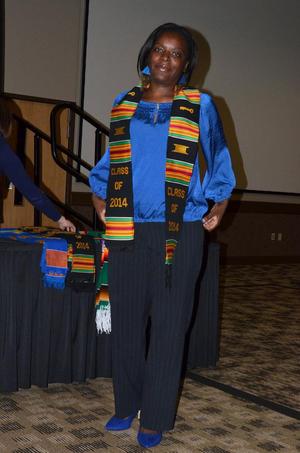 [Student wearing Kente stole and blue shirt]