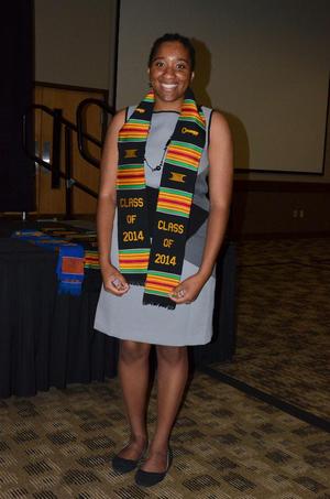 [Student wearing Kente stole and gray dress]