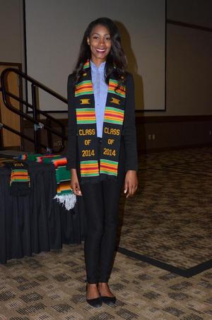 [Young woman in Kente stole, MC ceremony]