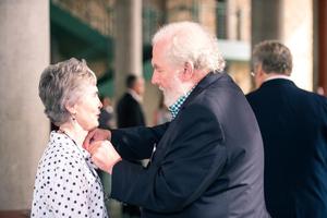 [A man pinning a woman's collar at the UNT College of Music Gala]