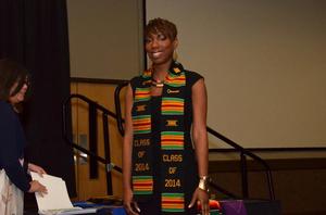 [Young woman in Kente stole at UNT ceremony]