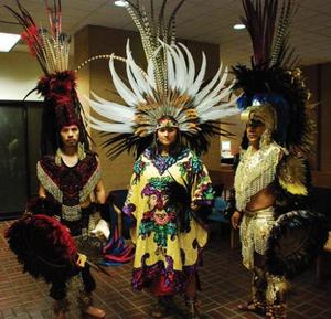 [Aztec dancers in traditional clothing]