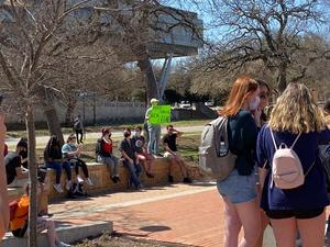 [Crowd and Sister Cindy outside UNT Union]