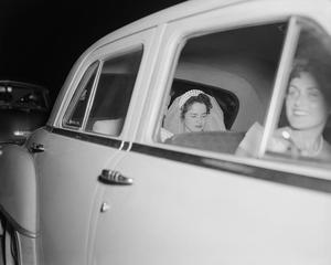 [Newlyweds Glenella and Robert (Bob) Scarborough in an automobile]