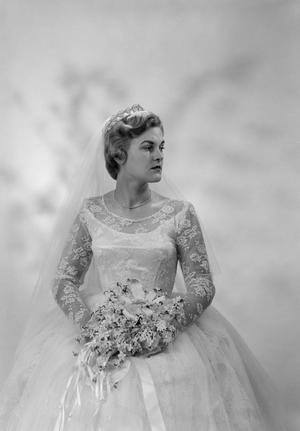 [Portrait of Jane Williams in a wedding dress, holding a bouquet, 6]
