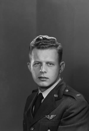 [Portrait of Richard Dus in a U.S. Air Force uniform, looking at the camera]